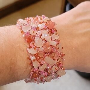 7" x 1 1/4" pink & red beaded bracelet.  Large stones & small beads. Magnetic
